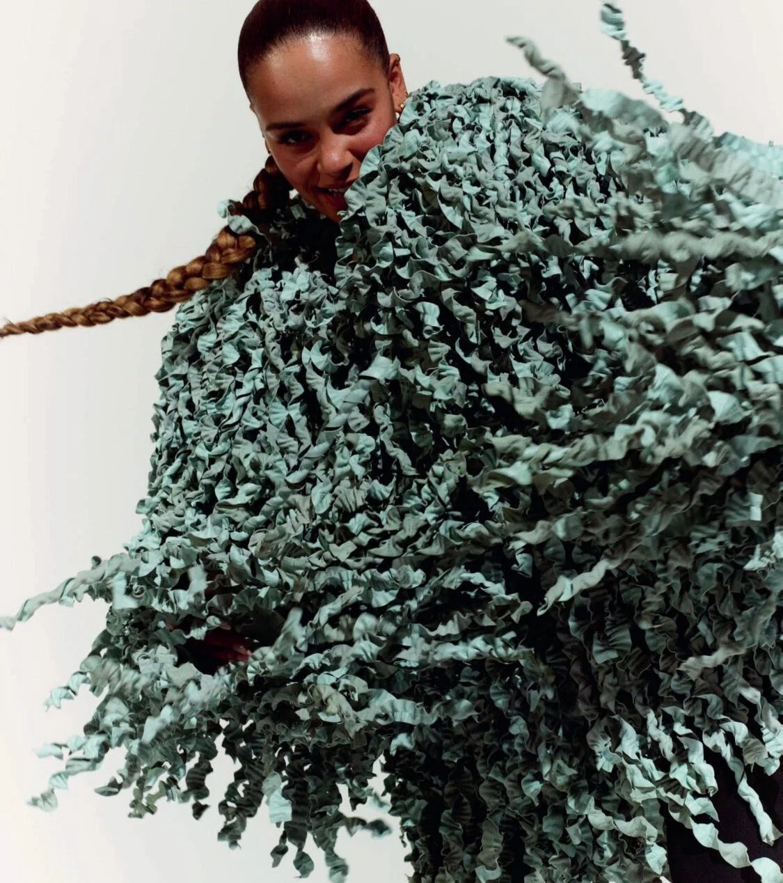 Jorja Smith wearing a sculptural green outfit for British Vogue