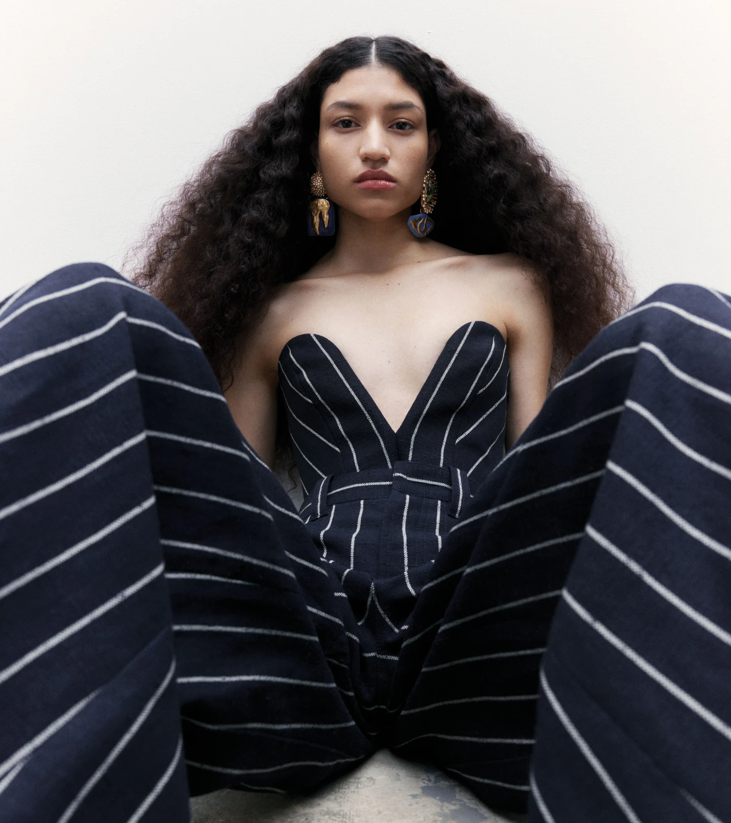 A sculptural black and white striped outfit